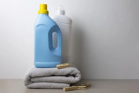 Laundry detergent bottles on color background, household cleaning concept Fotos de archivo