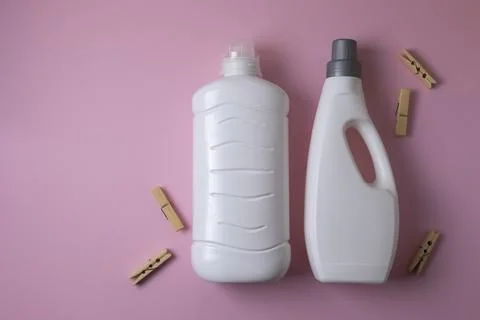 Laundry detergent bottles on color background, household cleaning concept Fotos de archivo