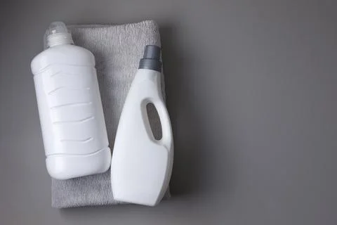 Laundry detergent bottles on color background, household cleaning concept Fotos de archivo