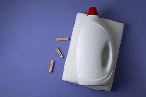 Laundry detergent bottles on color background, household cleaning concept Fotos de archivo