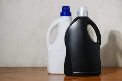 Laundry detergent bottles static display, in indoor tabletop, with white bo.. Stock Photos