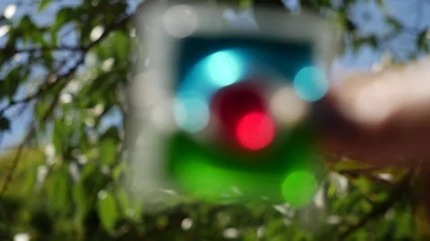 Laundry detergent pod. Men hand holds colorful water soluble sachet. Liquitabs. Видео 277540433