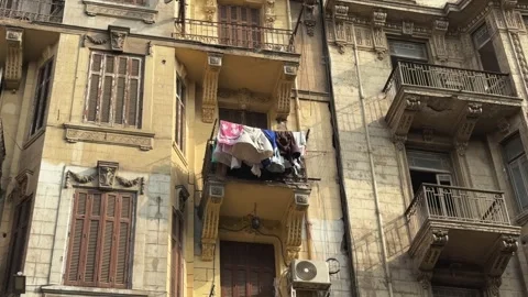 Laundry Drying on Balconies of Aged Neoclassical Apartment Building Facade Stock Footage 341995396