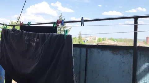 Laundry drying on a clothesline with scenic view in background Stock Footage 308367785