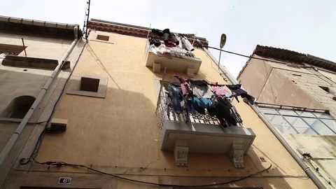 Laundry drying in front of building Stock-Footage 76284860