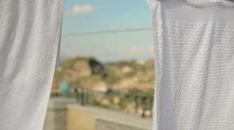 Laundry drying on the hotel (focus) Stock Footage 12128314