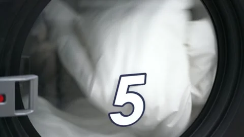 Laundry drying inside public dryer machine close up 스톡 동영상 323731065