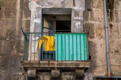 Laundry drying on old balcony. Fotos de archivo