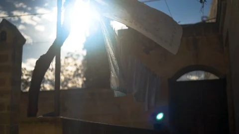 Laundry drying outside house in Matera on a sunny day Stock Footage 108734498