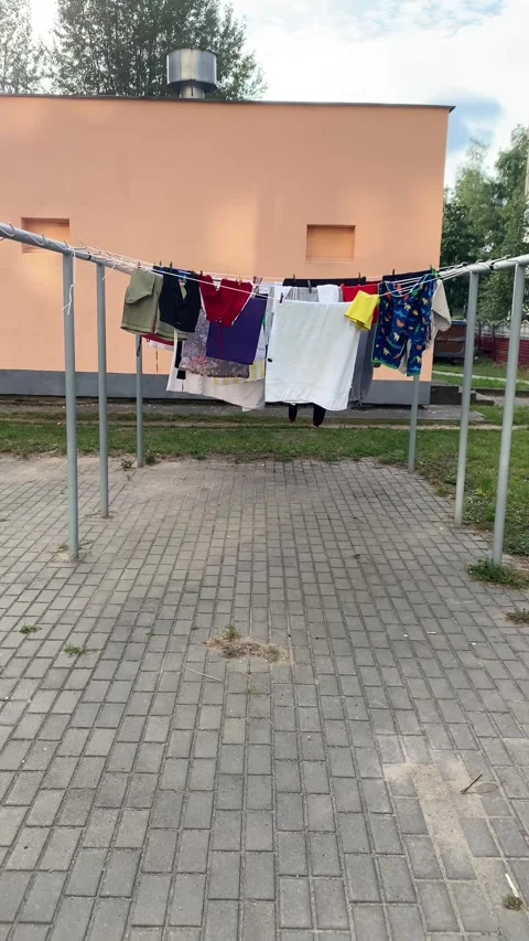 Laundry drying outside. Wind. Vertical video Stock Footage 282445768