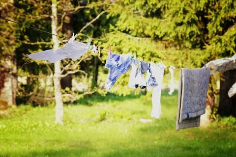 Laundry drying on a rope in nature Stock Photos