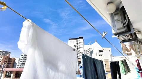 Laundry Drying Under the Sun in Naha, Okinawa - Dec 2, 2024 Stock Footage 299484397