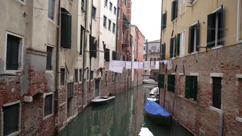 Laundry drying in Venice. Laundry hangs on a line between the streets. Stock Footage 284868722