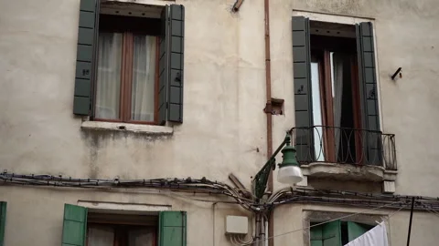 Laundry drying in Venice. Laundry hangs on a line between the streets. Video stock 288497599