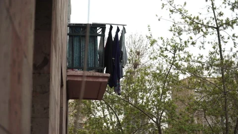 Laundry Drying in the Warm Breeze on Balcony of House in Erevan City. Stock Footage 176332750