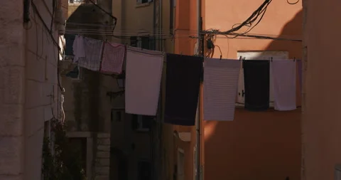 Laundry Hanging Across Narrow Old Town Street Video stock 335347521