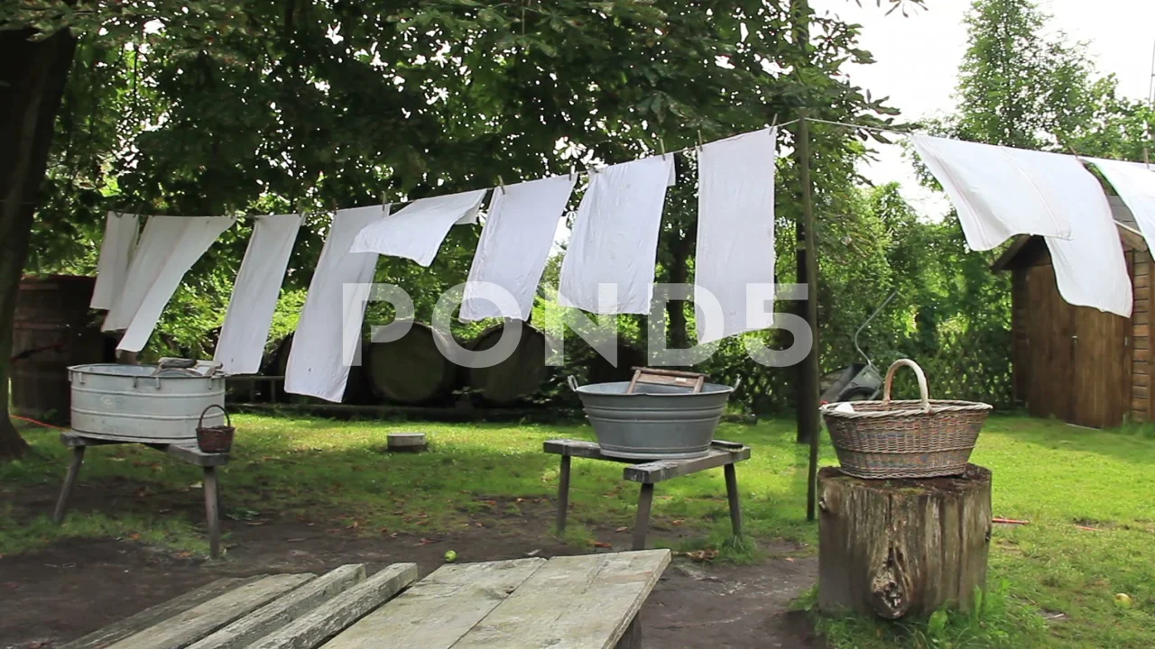 Laundry hanging on clothesline. Old, vin, Stock Video
