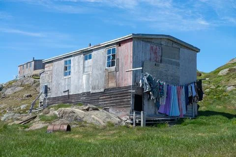 Laundry hanging to dry on old rustic building in Greenland Фото