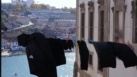 Laundry Hanging Gracefully Over a Stunning View of Porto Coastal City. Stock Footage 305459600