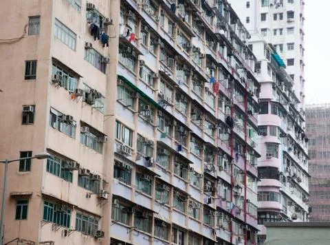 Laundry hanging out apartment windows Stock Photos
