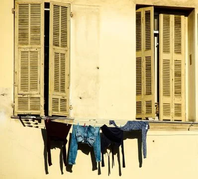 Laundry hanging out of a typical Nice facade Foto stock