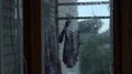 Laundry hanging on rope in rural house, camp of refugees escaping from war HD Footage