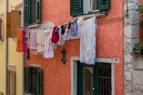 Laundry on house wall Stock Photos