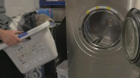 Laundry industrial washing machine loading. 스톡 동영상 101775854