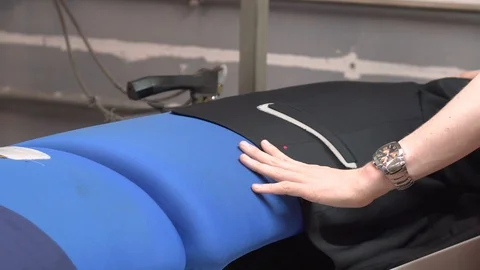 Laundry industry. Ironing a jacket. Automatic presser ironing jacket. Stock Footage 109180252