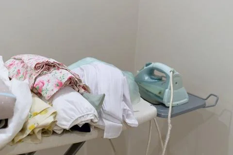 Laundry is on the ironing board Stock Photos