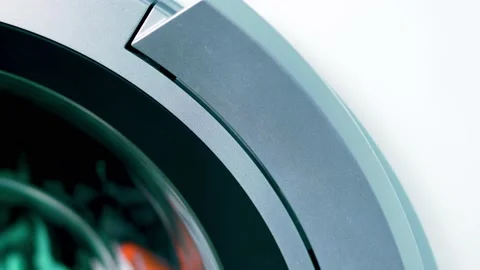 Laundry, Macro. Close-up of a Part of a Round Washing Rotating Drum. Background  Stock Footage 142438755