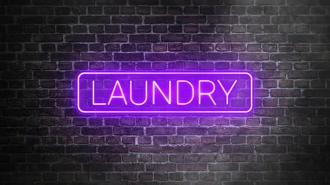 Laundry neon signboard on bricks wall background. Concept of laundry store front Stock Footage 220857454