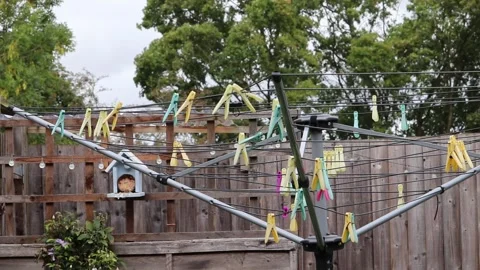 Laundry pegs on a line blowing in the wind Video stock 138027514