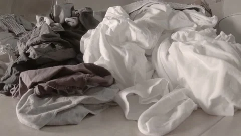 Laundry piling up in the bathroom - Slider shot Stock Footage 170554151