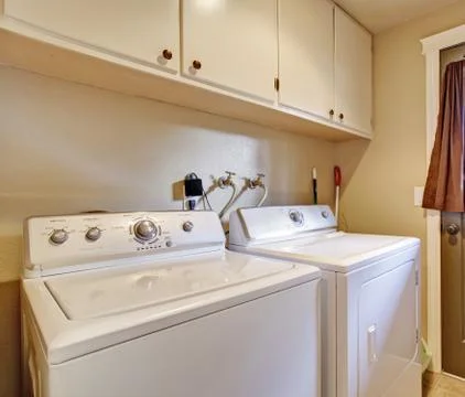Laundry room with exit to backyard Stock Photos