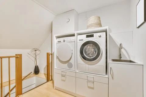 Laundry room with washing machine Stock Photos