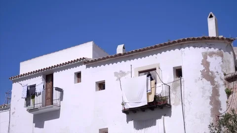 Laundry on Spanish balcony Stock Footage 98435234