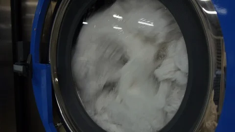 Laundry spinning in the inside of the washing machine Stock Footage 104023333