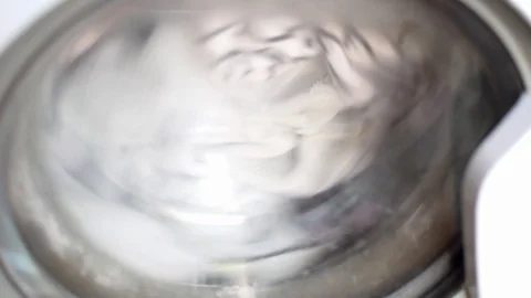 The laundry is spinning in the washing machine. Stock Footage 127761121