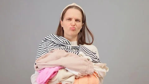 Laundry tasks. Housework routine. Household linen. Young attractive woman Stock Footage 257762680