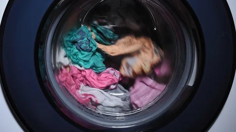 Laundry is washed in an automatic washing machine, rotates in the drum. washing Stock Footage 126625827