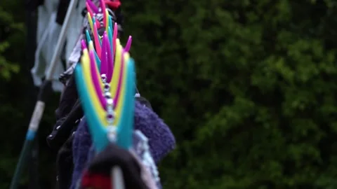 Laundry washing drying on the line with pegs Stock Footage 274660047