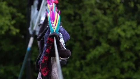Laundry washing drying on the line with pegs Stock Footage 276437735