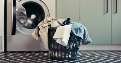 Laundry, washing machine and basket with clothes on floor for maintenance Stock Footage 312783618