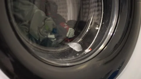 Laundry Washing Machine with Clothes and Debris Inside Drum Stock Footage 329418336
