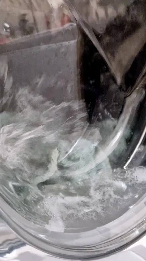 Laundry Washing Machine Drum Rotating With Clothes Stock Footage 319013912