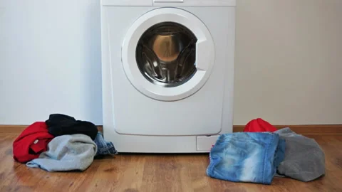 Laundry washing machine washes colored clothing. Loading washing machine Video stock 112149704