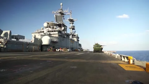 LAV-25's parked on flight deck of USS Wasp (LHD 1) during live fire exercise Video stock 284083618