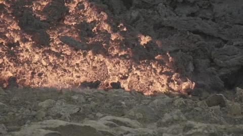 Lava approaching and burning the ground, 60fps, Iceland 4K Stock Footage 248244647
