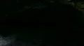 Lava Caves 02 Man walking into dark cave HD Footage
